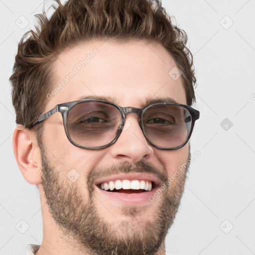 Joyful white adult male with short  brown hair and grey eyes