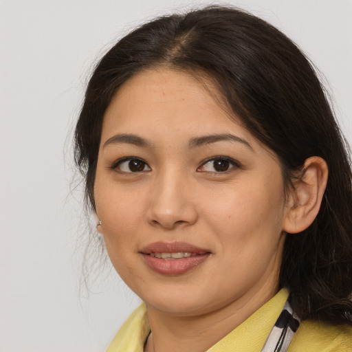 Joyful asian young-adult female with medium  brown hair and brown eyes