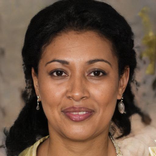 Joyful latino young-adult female with medium  black hair and brown eyes