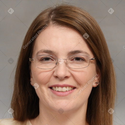 Joyful white adult female with medium  brown hair and blue eyes