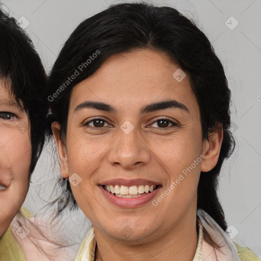 Joyful latino young-adult female with medium  brown hair and brown eyes