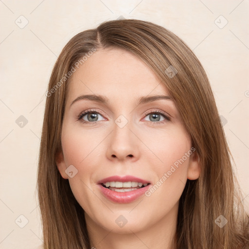 Joyful white young-adult female with long  brown hair and green eyes