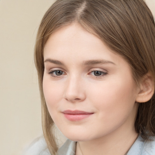 Joyful white child female with medium  brown hair and brown eyes