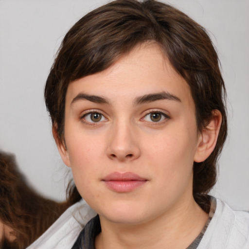 Neutral white young-adult female with medium  brown hair and brown eyes