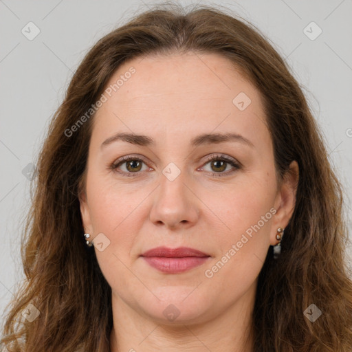 Joyful white adult female with long  brown hair and brown eyes