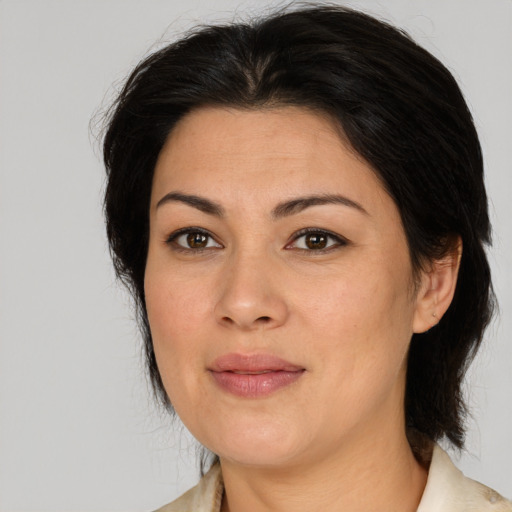 Joyful asian adult female with medium  brown hair and brown eyes