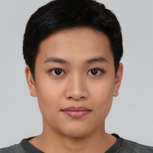 Joyful asian young-adult female with short  black hair and brown eyes