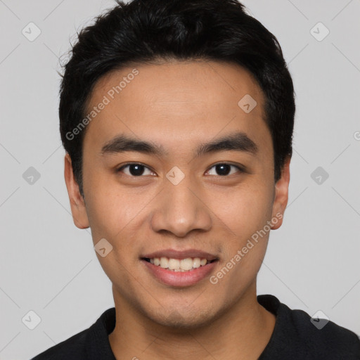 Joyful asian young-adult male with short  black hair and brown eyes