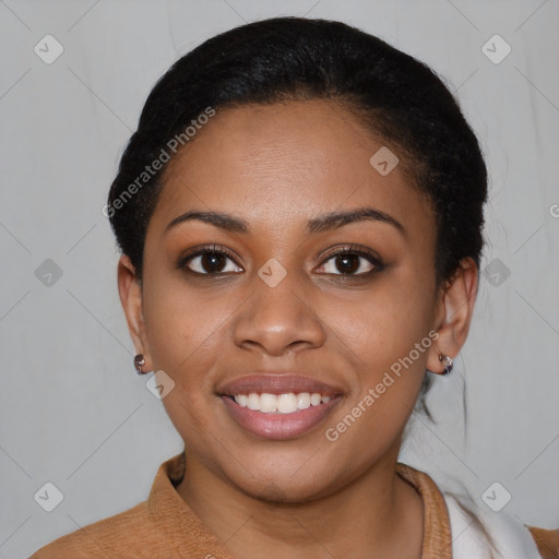 Joyful black young-adult female with short  black hair and brown eyes