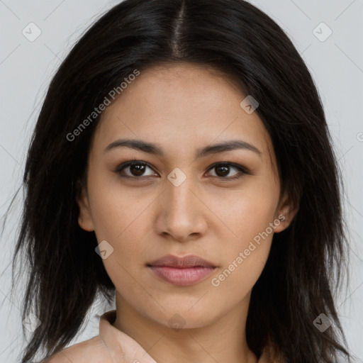 Joyful latino young-adult female with long  brown hair and brown eyes