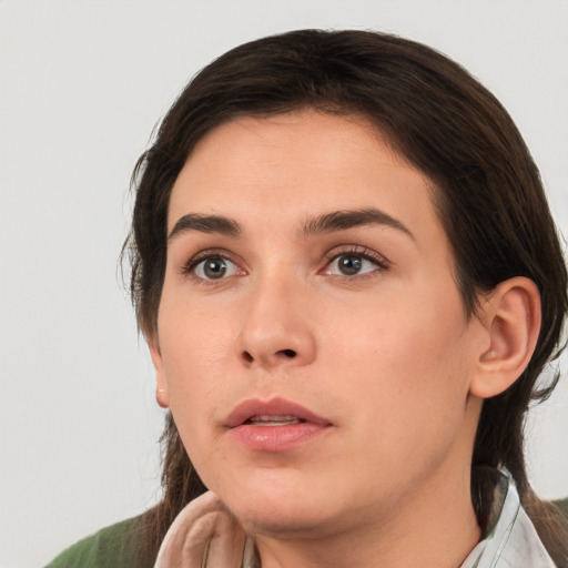 Neutral white young-adult female with medium  brown hair and brown eyes