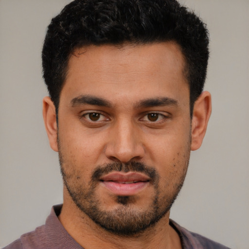 Neutral latino young-adult male with short  black hair and brown eyes