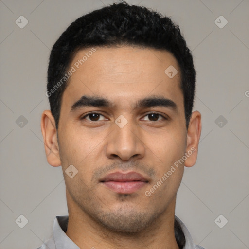 Joyful latino young-adult male with short  black hair and brown eyes