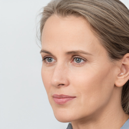 Neutral white young-adult female with medium  brown hair and grey eyes