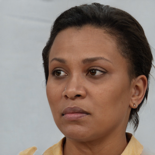 Neutral black young-adult female with short  brown hair and brown eyes