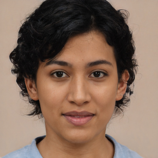 Joyful latino young-adult female with medium  black hair and brown eyes
