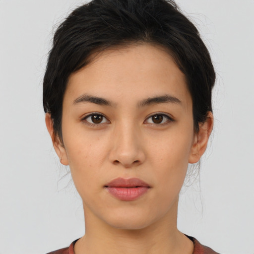 Neutral latino young-adult female with medium  brown hair and brown eyes
