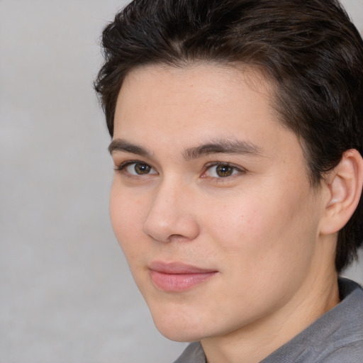 Joyful white young-adult male with medium  brown hair and brown eyes
