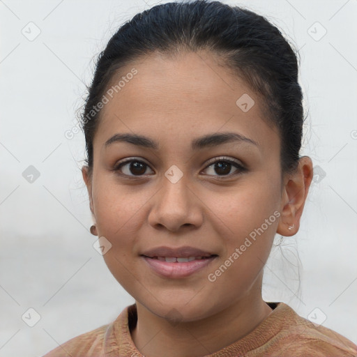 Joyful latino young-adult female with short  brown hair and brown eyes