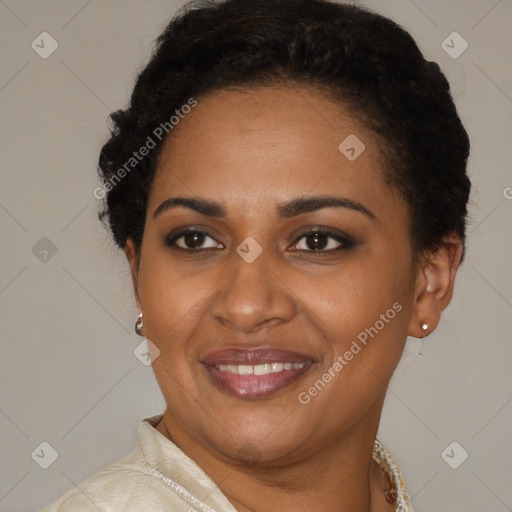 Joyful black adult female with short  brown hair and brown eyes