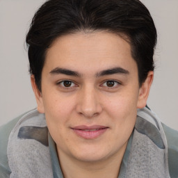 Joyful white young-adult male with medium  brown hair and brown eyes