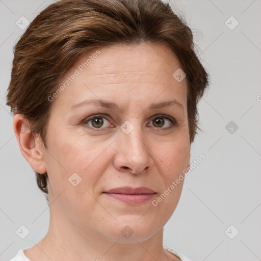 Joyful white adult female with short  brown hair and grey eyes