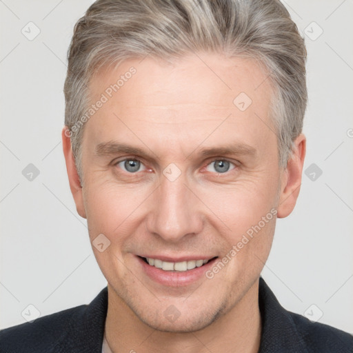 Joyful white adult male with short  brown hair and grey eyes