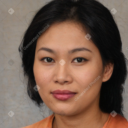 Joyful asian young-adult female with medium  black hair and brown eyes