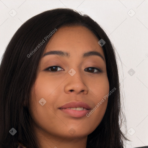 Joyful latino young-adult female with long  brown hair and brown eyes