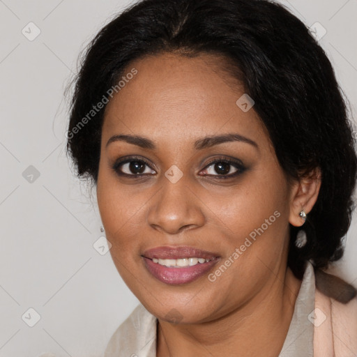 Joyful black young-adult female with long  brown hair and brown eyes