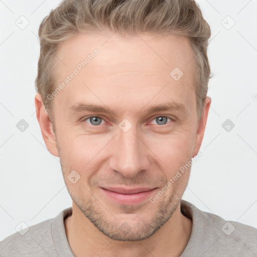 Joyful white adult male with short  brown hair and grey eyes