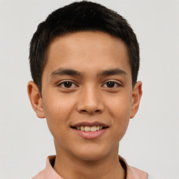 Joyful latino young-adult male with short  brown hair and brown eyes