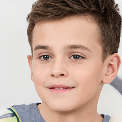 Joyful white child male with short  brown hair and brown eyes