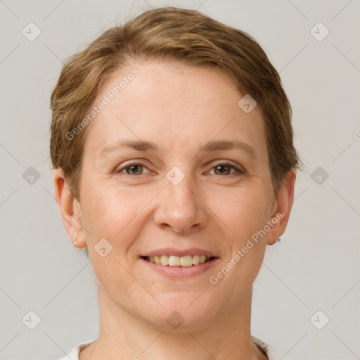 Joyful white adult female with short  brown hair and grey eyes