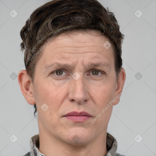 Joyful white adult male with short  brown hair and grey eyes