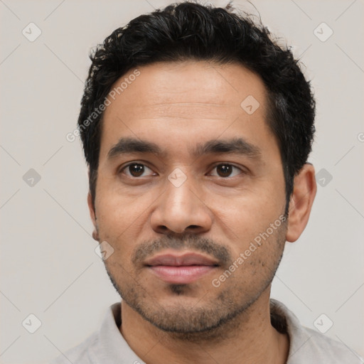 Neutral latino adult male with short  black hair and brown eyes