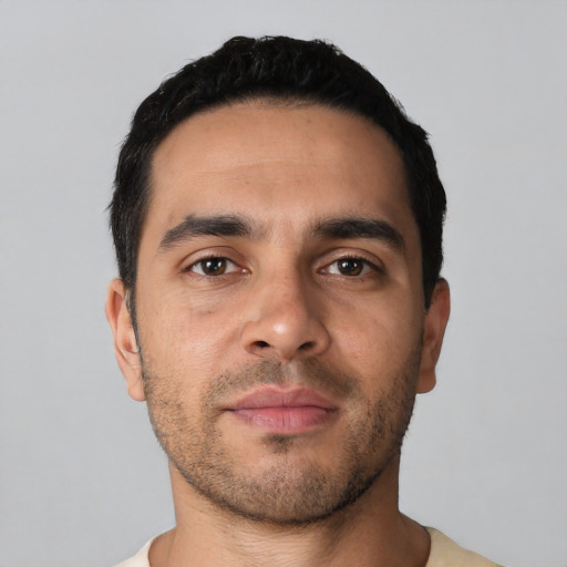 Neutral latino young-adult male with short  black hair and brown eyes