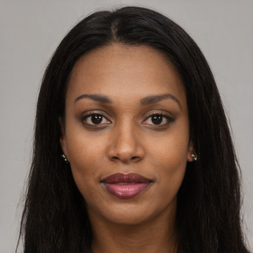 Joyful asian young-adult female with long  black hair and brown eyes