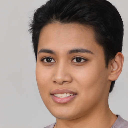 Joyful asian young-adult female with medium  black hair and brown eyes