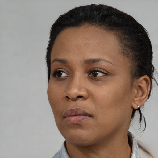 Neutral black young-adult female with medium  black hair and brown eyes