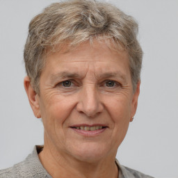 Joyful white middle-aged male with short  brown hair and brown eyes