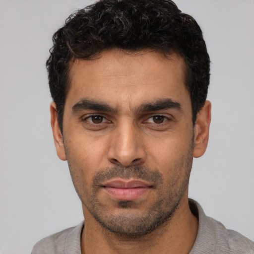 Neutral white young-adult male with short  black hair and brown eyes