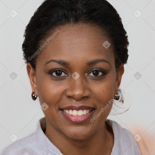 Joyful black young-adult female with short  brown hair and brown eyes