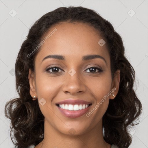 Joyful latino young-adult female with long  brown hair and brown eyes