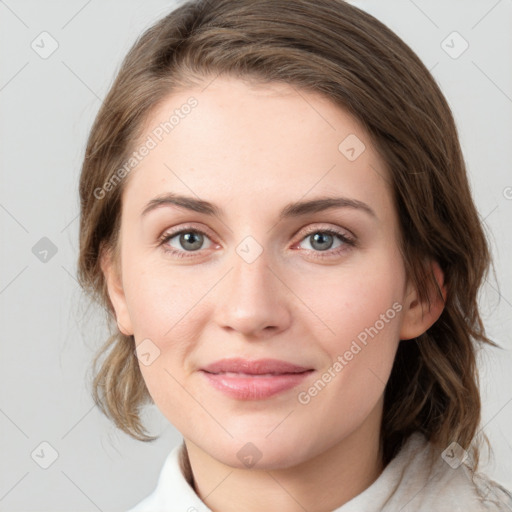 Joyful white young-adult female with medium  brown hair and green eyes