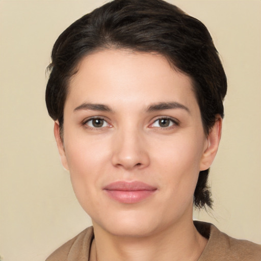 Joyful white young-adult female with medium  brown hair and brown eyes