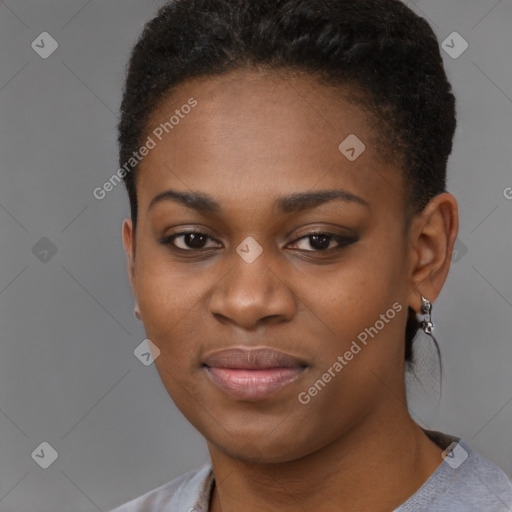 Joyful black young-adult female with short  black hair and brown eyes