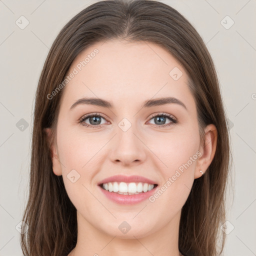 Joyful white young-adult female with long  brown hair and grey eyes