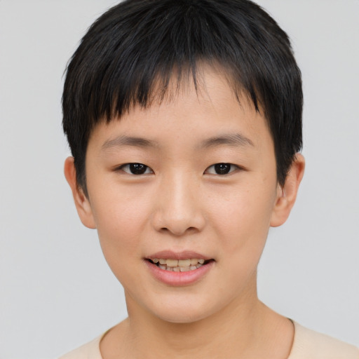 Joyful asian child male with short  brown hair and brown eyes