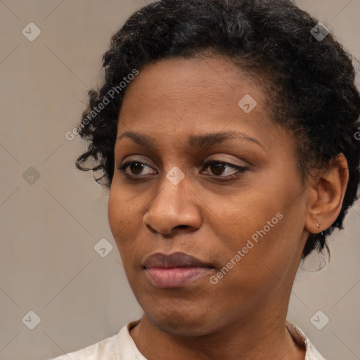 Joyful latino adult female with short  brown hair and brown eyes